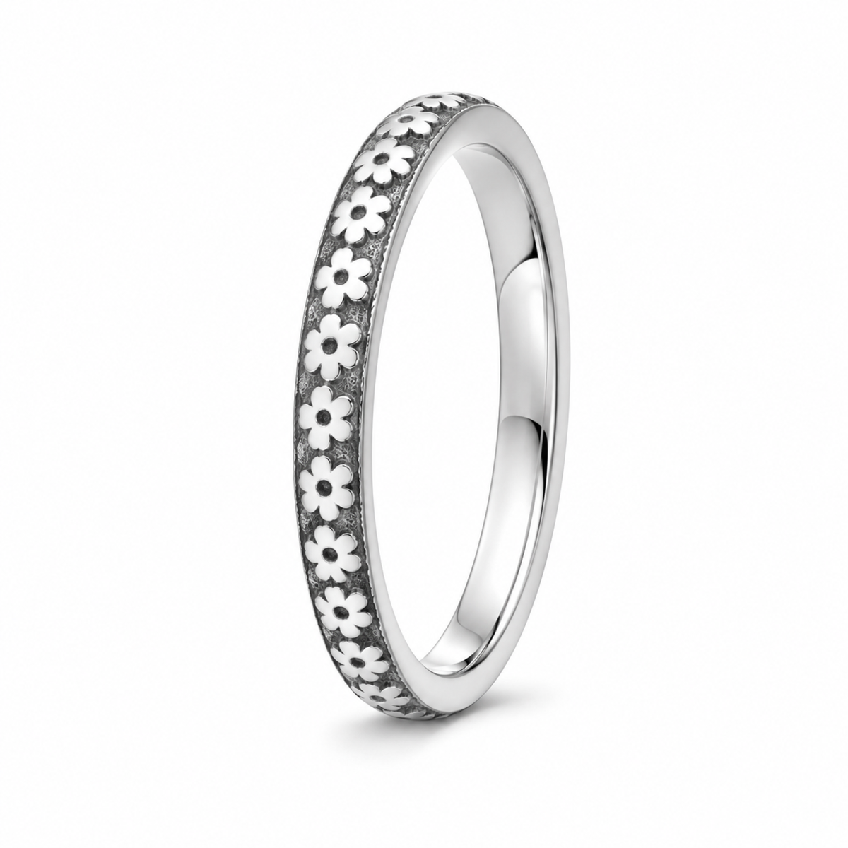 A platinum wedding ring featuring a continuous row of small white daisy flowers with dark centers.