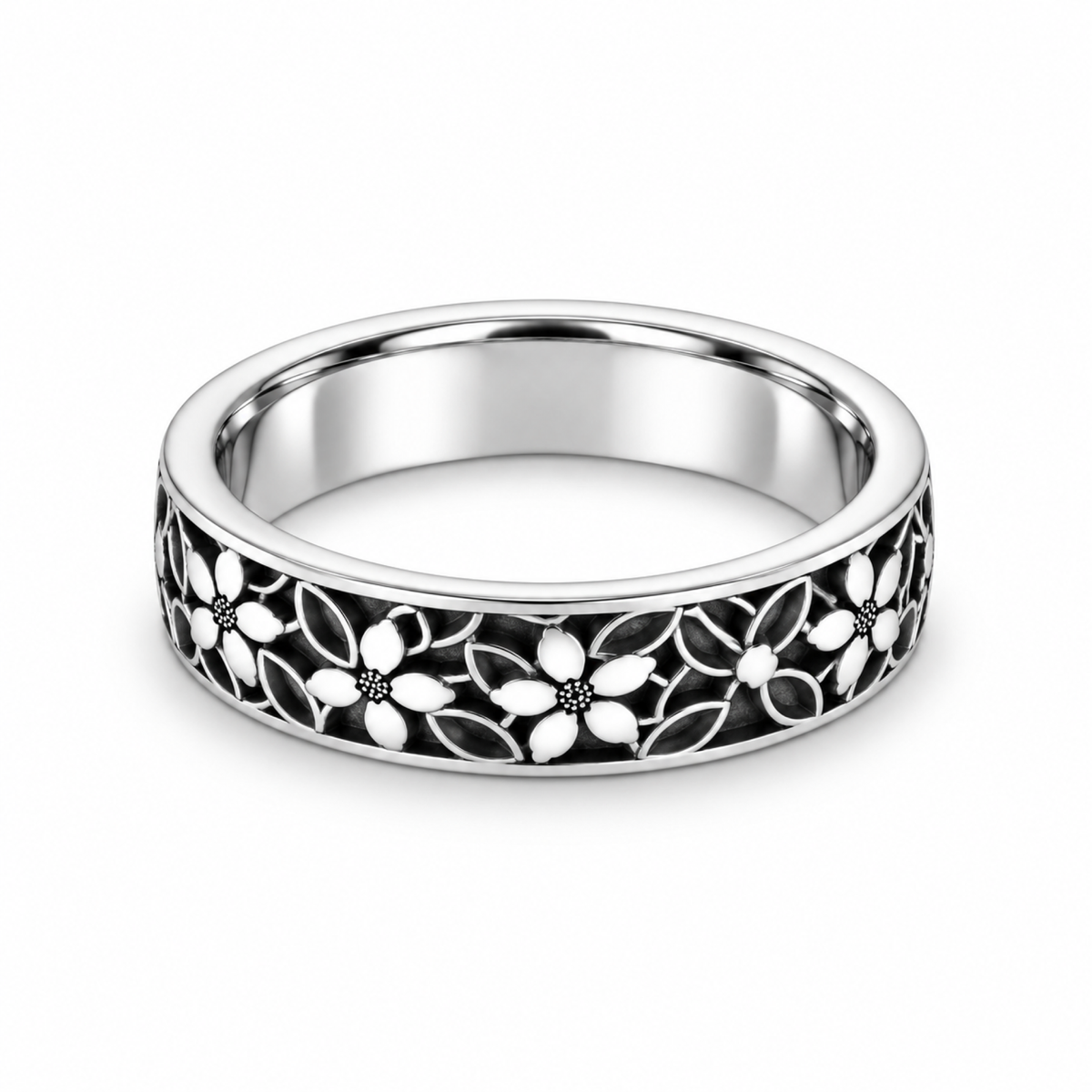 A platinum wedding ring featuring an openwork floral filigree pattern with black inlay.