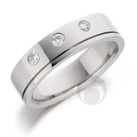 A diamond platinum wedding ring with multiple small diamond accents set in a polished or matte finish.