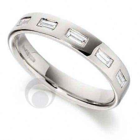 A platinum diamond wedding set with five baguette cut diamonds.