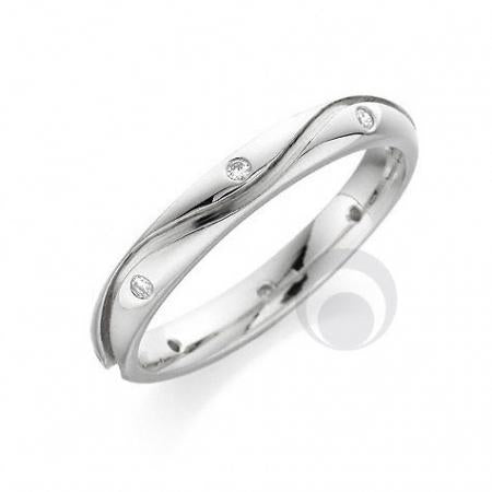 A polished diamond platinum wedding ring with a round brilliant cut diamond in the center.