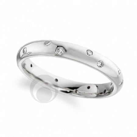 A platinum diamond set wedding band set with multiple round cut diamonds.