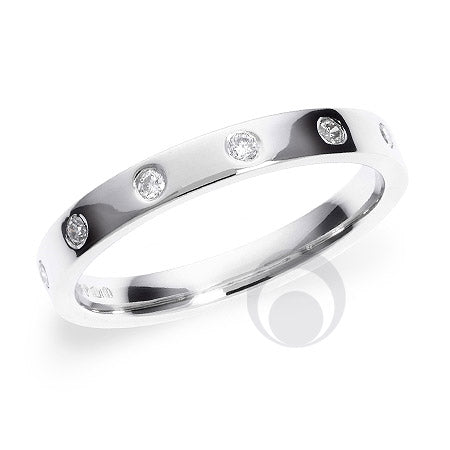 A polished diamond platinum wedding ring with a round brilliant cut diamond in the center surrounded by diamonds set in a polished metal band.