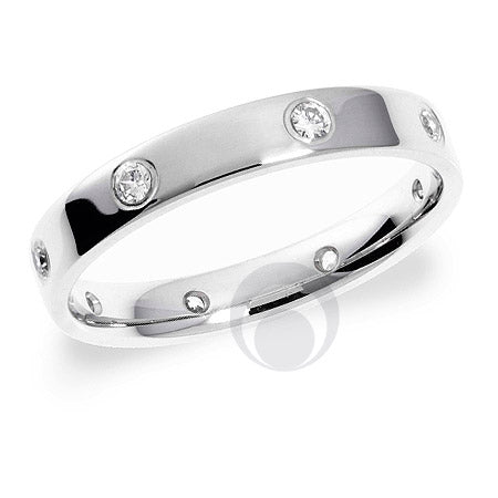 A polished diamond platinum wedding ring with multiple round brilliant cut diamonds set around the band.