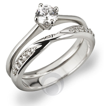 A platinum diamond solitaire with a shaped platinum diamond set wedding ring.