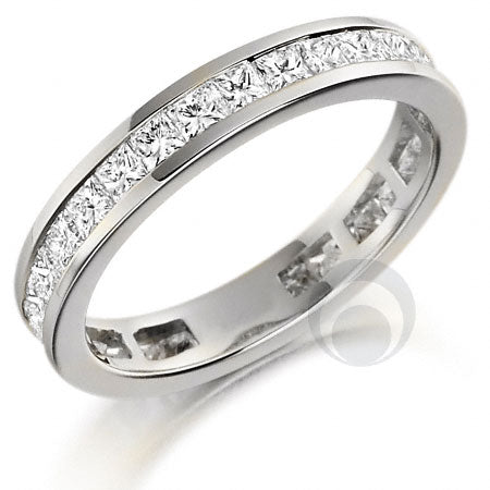 A platinum diamond eternity ring set with princess cut diamonds. Diamonds set within a channel.