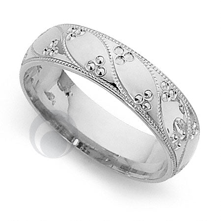 A platinum patterned wedding ring wtth a bead design,