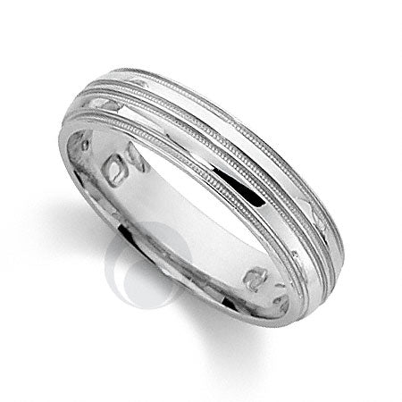 A polished platinum wedding ring with a classic cut pattern
