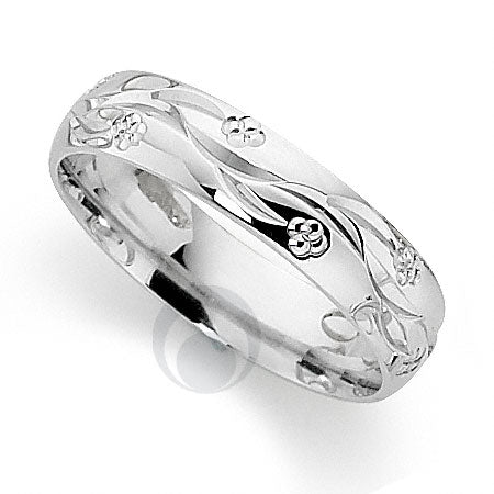 A patterned platinum wedding ring with a blossom engraved pattern.