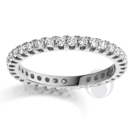 A polished platinum wedding ring with a set diamond band.