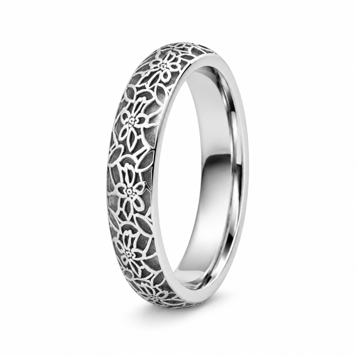 A filigree platinum wedding ring with an intricate openwork floral pattern.