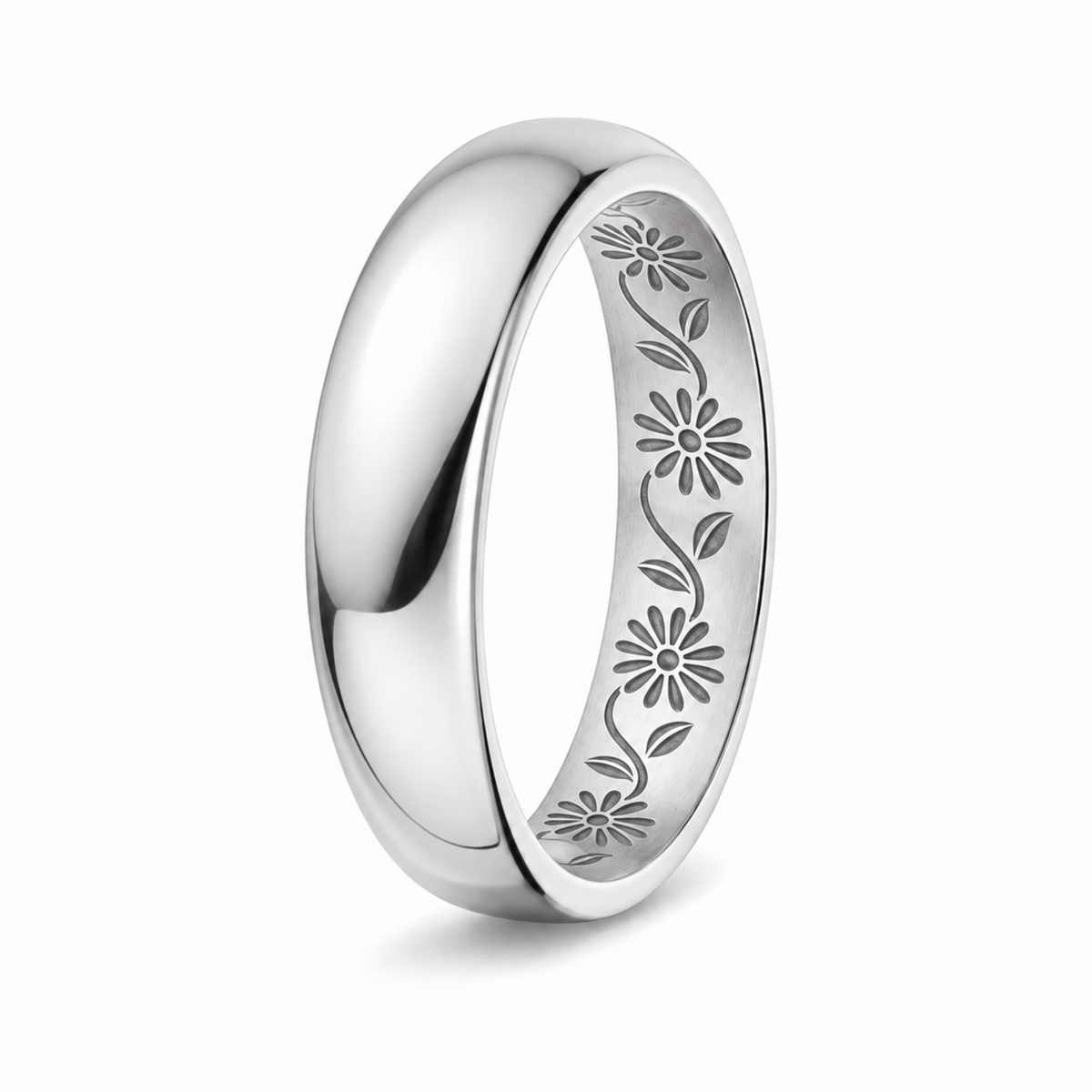 A pplatinum wedding ring with an engraved floral pattern inside the band.