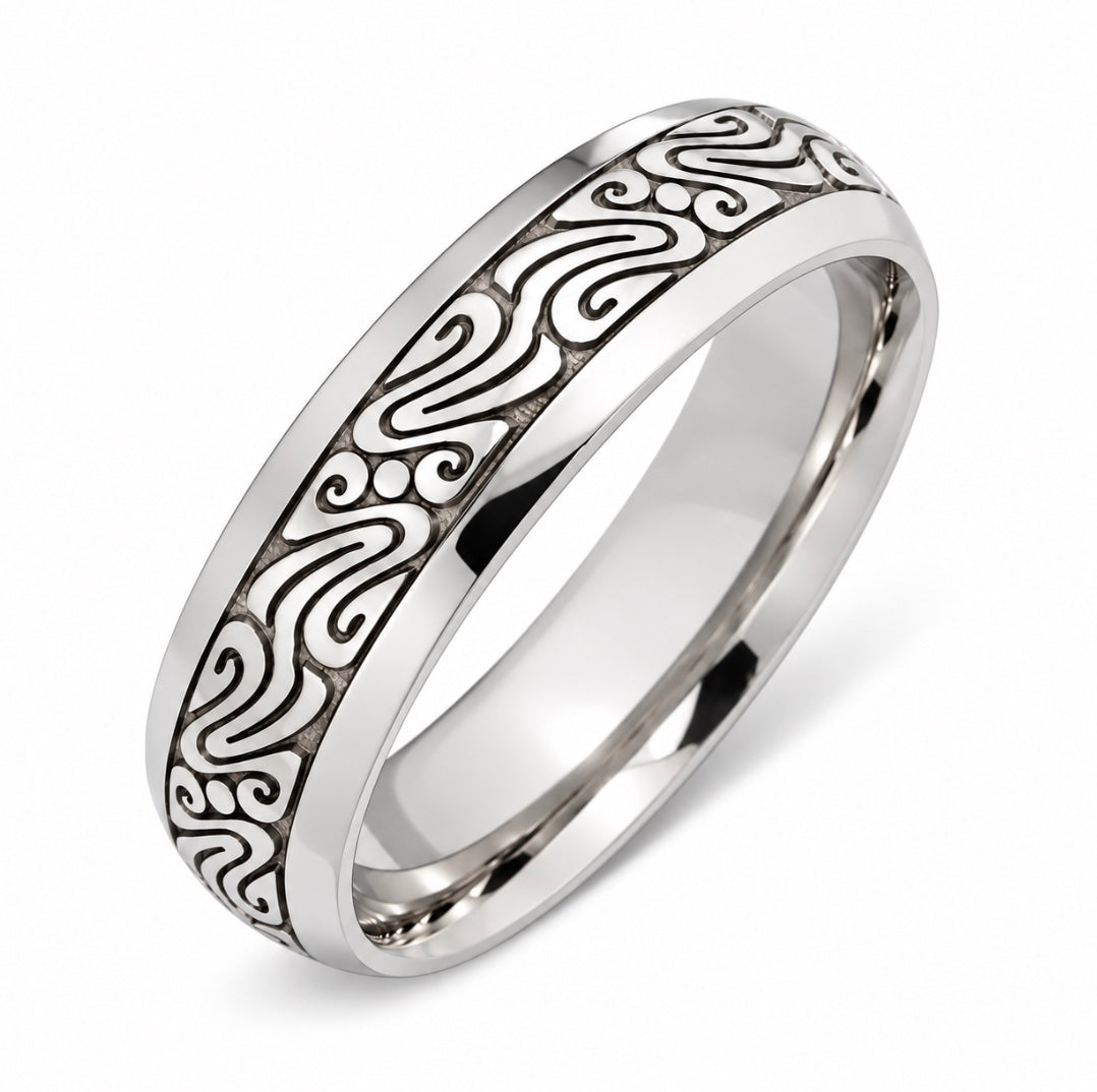 A platinum band ring with a polished finish and an engraved celtic pattern.