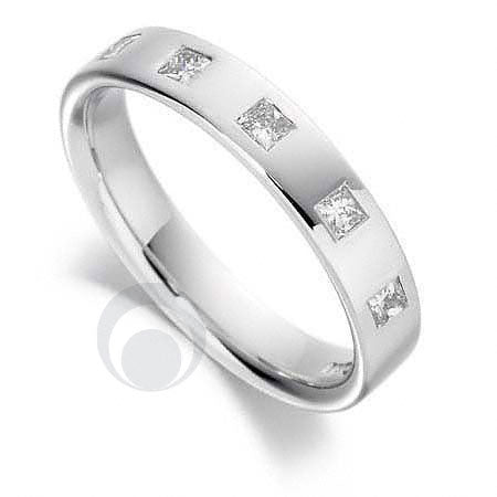 A diamond platinum wedding ring with a polished finish, featuring a central diamond and smaller surrounding diamonds set in a plain band.