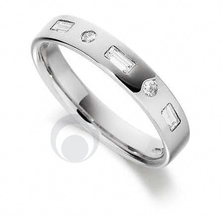 A Platinum diamond set wedding ring with three baguette diamonds set within the ring and two round cut diamonds set between the baguette diamonds.