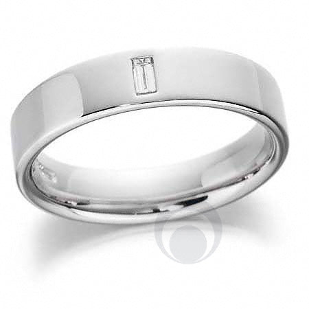 A polished diamond platinum wedding ring with a baguette cut diamond centerpiece.