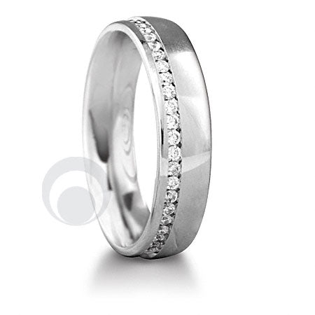 A platinum diamond set wedding ring with a channel of diamonds set on an outer edge of the ring.