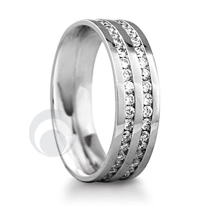 A polished platinum wedding ring with two channels set with round cut diamonds.