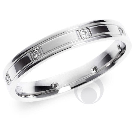A polished diamond platinum wedding ring with a round brilliant cut diamond centerpiece.