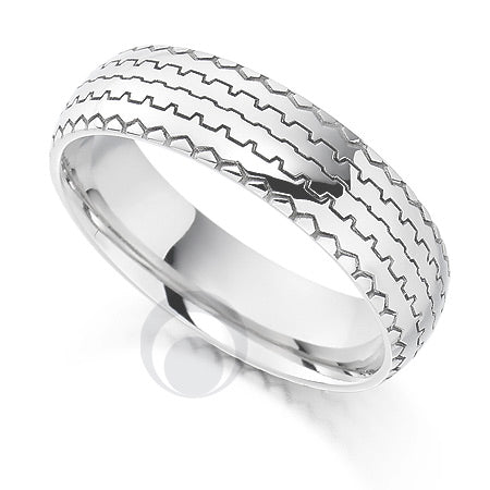 A polished platinum wedding ring with a contemporary tread pattern design.
