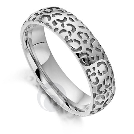 A polished platinum wedding ring with a cheetah pattern design.