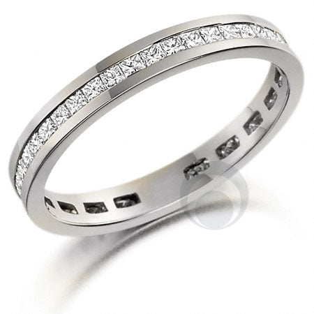 A platinum diamond eternity ring set with princess cut diamonds. Diamonds set within a channel.