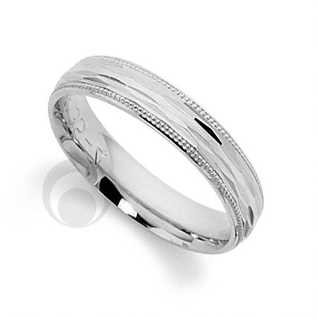A polished platinum wedding ring with a classic cut pattern.