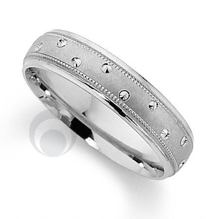A polished platinum wedding ring with a classic cut pattern.