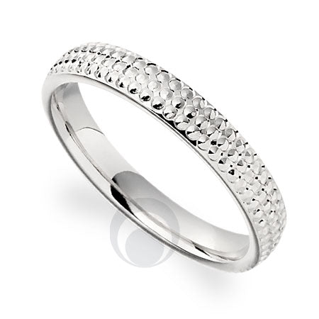 A patterned platinum wedding ring.