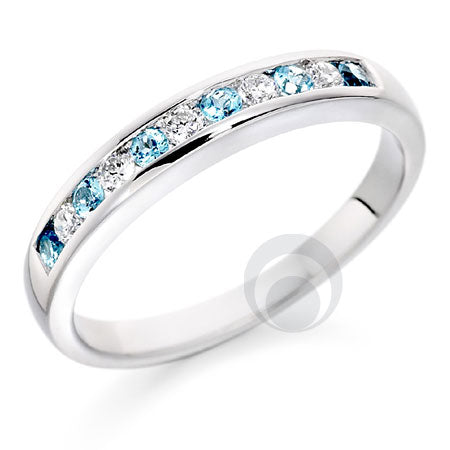 A platinum eternity ring with channel-set blue topaz and diamonds